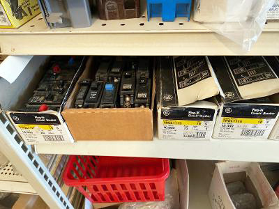 Fuses in boxes on a warehouse shelf.