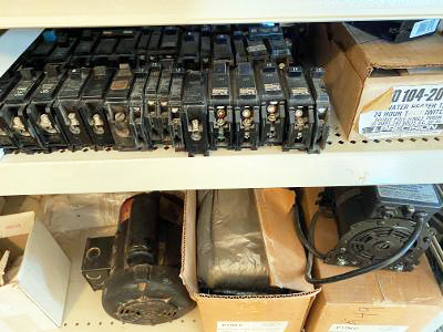 Fuses in boxes on a warehouse shelf.